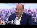 Suits star Rick Hoffman Louis Litt learns Kiwi lingo on The AM Show Newshub