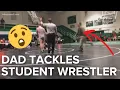 Dad tackles wrestler at high school match