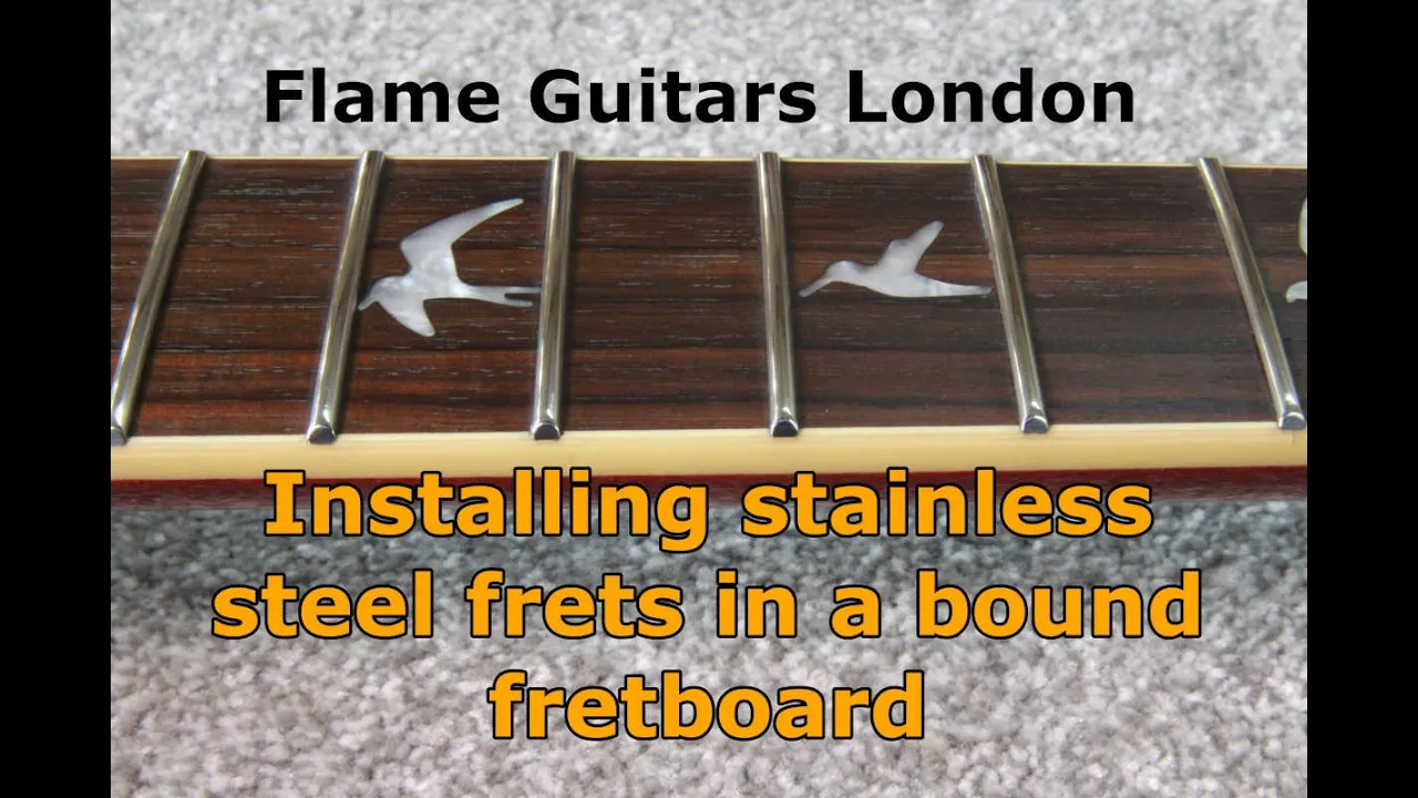 Installing stainless steel frets in a bound fretboard