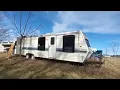 Junkyard Parts Picking Looking for Camper Parts in a Large Auto Wrecking Yard