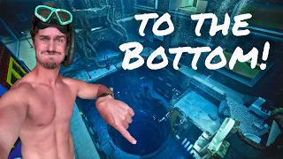 attempting to swim to the bottom of the deepest pool in the world