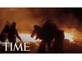 Lagu A Protestor Throws A Molotov Cocktail Towards Riot Police During Clashes In Kiev | TIME