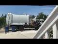 City of Virginia Beach Virginia trash truck picking up a broken can at the beach