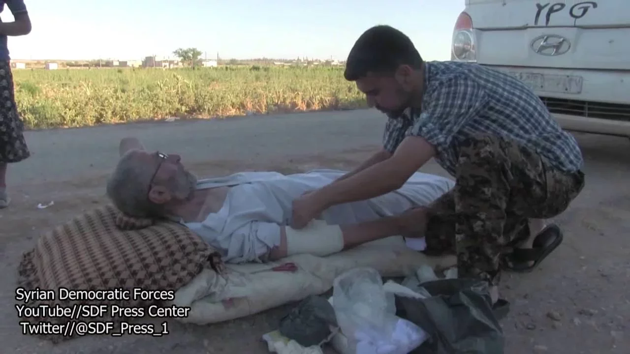 SDF Medics Aid an Aged was Shot Three Times By ISIl Terrorists in His Hand and foot 2016.07.15