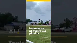 Truck crashes into traffic light pole after high-speed police chase