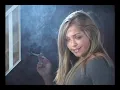 Beautiful blonde smokes an all white cigarette