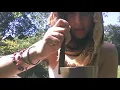 Hairy teen girl meditates in nature