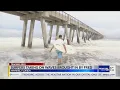 Navarre Beach surfers brave rough surf as Fred creates tough conditions