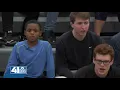 Olathe West basketball team embraces young fan with intellectual disability