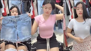 live preloved wearing a black mini skirt