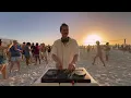 playing house music on the beach until people dance