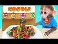 Download Lagu Monkey baby Bon Bon eats colorful pasta and swims with the puppy in the pool