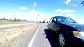 Vehicle Passenger Attempts to Slash Bicyclist with Knife