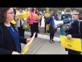 Crowd walks in down Peoria on Holocaust Remembrance Day