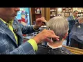 Trying out new machine how s the sound Arthur Rubinoff at NYC Barber Shop Museum