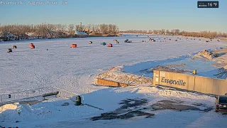 Time-lapse of ice fishing shelters via Saginaw River Cam Jan 31 2026 from 6 00 am 9 00 pm