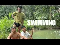 boys swimming in the river