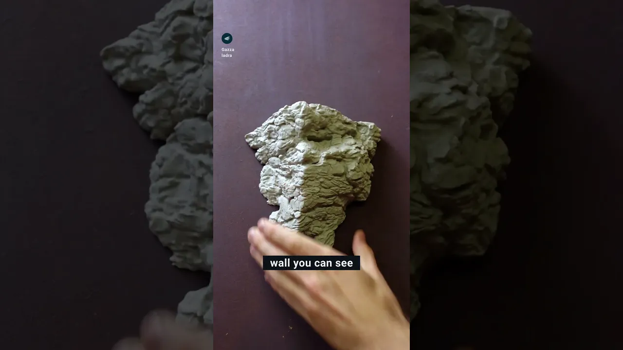 Rock wall shelf with face video thumbnail
