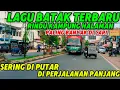 Download Lagu Lagu batak terbaru paling banyak Di cari Sering Putar Di Perjalanan naik Bus rindu kampung halaman