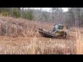 2011 John Deere 323D cutting brush