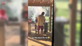 Man Rushes to Put Out Flames After Grill Catches Fire - 1505691