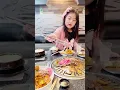 Suzy is cooking Korean BBQ