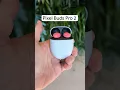 A YouTube Short showing someone flipping the Pixel Buds Pro 2 case open and shut multiple times. Each time the case opens, new text appears on the screen to explain the Buds' features.
