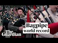 Download Lagu Watch 374 bagpipe players break world record with AC/DC tribute