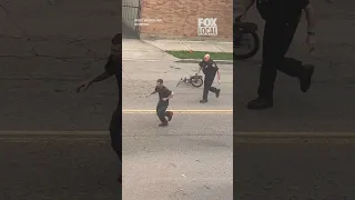 VIRAL STREET SCUFFLE captures a fight between a police officer and a man on April 3 2026