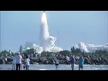 Spectators at Jetty Park in Cape Canaveral watch a Delta 2 rocket launching NASA s GRAIL mission