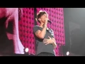 One Direction in concert singing \