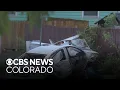 Driver arrested by Denver police after car crash damages home several people injured