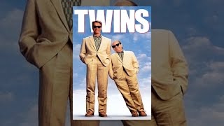 Arnold Schwarzenegger's Julius Benedict hugs his twin—Danny DeVito's Vincent Benedict—in the Twins game