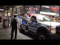 NEWER NYPD TOW TRUCK GIVING A CHARGE TO A NYPD TRAFFIC SUPERVISOR S UNIT IN TIMES SQUARE NYC