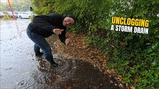 #080-2 Unclogging a storm drain on a parking space after rain in Germany