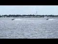 Two cigarette boats go by Manatee River in Bradenton FL