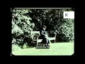1960s UK, Lone Woman Sitting on Park Bench, 16mm
