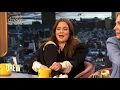 Drew Barrymore takes her shoe and black sock off