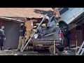 Toyota SUV lands on house in tree