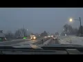 Snow accumulating on roads near downtown Littleton
