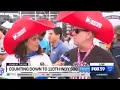 Indy 500 Kit and Hannah with big hats and free stuff