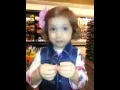 Kadance trying to pick flowers at Vons