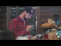 Barista Cashier communicates with the guests coffee