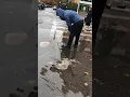 Being A Good Neighbor Watch How A Passerby Is Clearing A Clogged drain