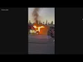 Car fire catches pawn shop on fire in North Spokane