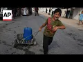 Palestinian displaced struggle with lack of water and food in Gaza Strip