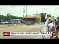 Protesters and demonstrators voice their first amendment right along the street of Canton
