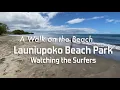 Walking through the surf while watching surfers at Launiupoko Beach in Lahaina, Maui, Hawaii  4K