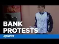 Protesters urge Wells Fargo Chase customers to close their accounts