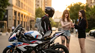 She holds a drink for him; he takes it after switching from skateboard to motorcycle #moto #skate